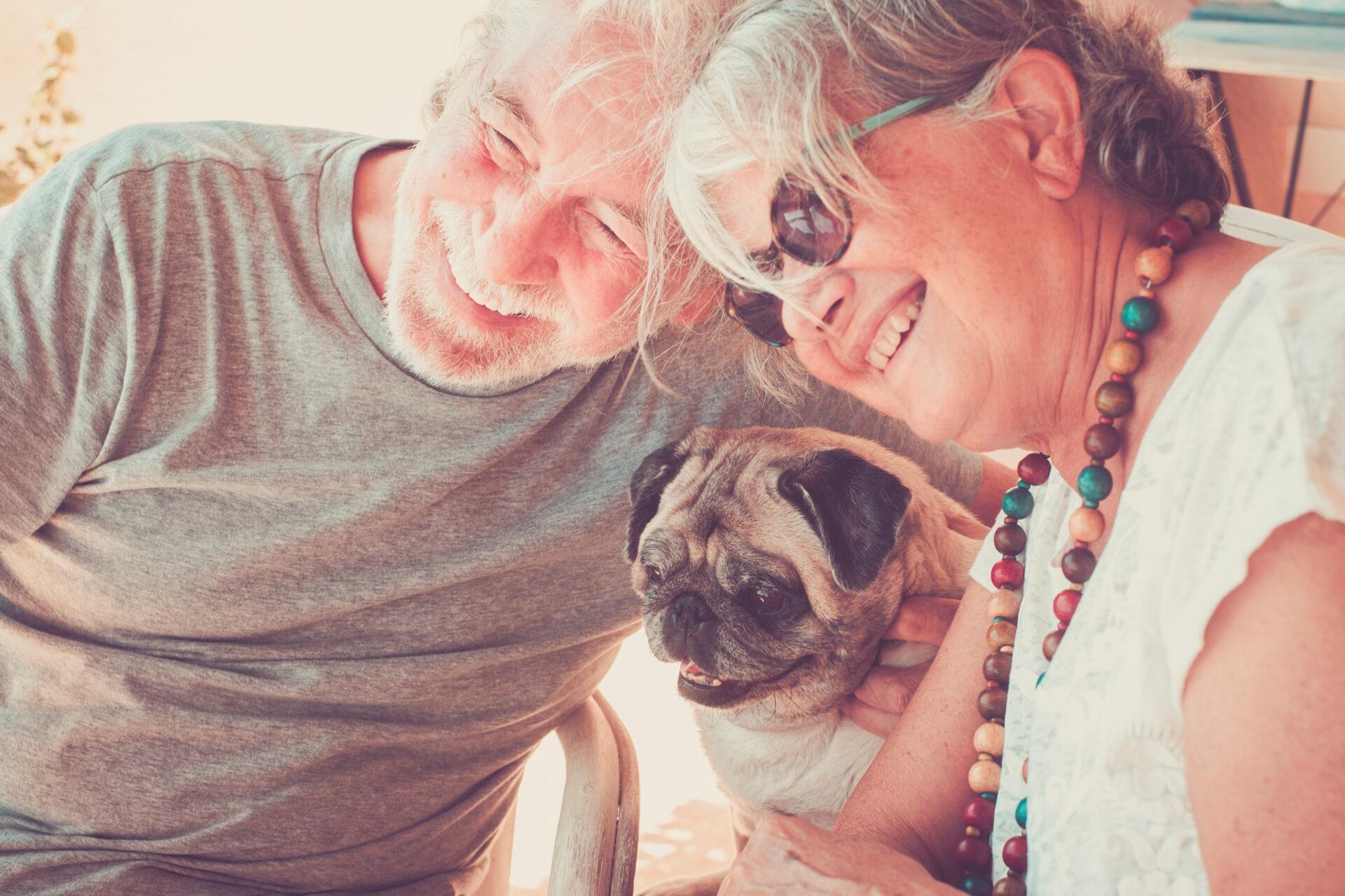 Funny happy portrait with two senior people man and woman with f attachment-based therapy in reno, nv, image of couple with dog illustrating benefits of attachment-based therapy