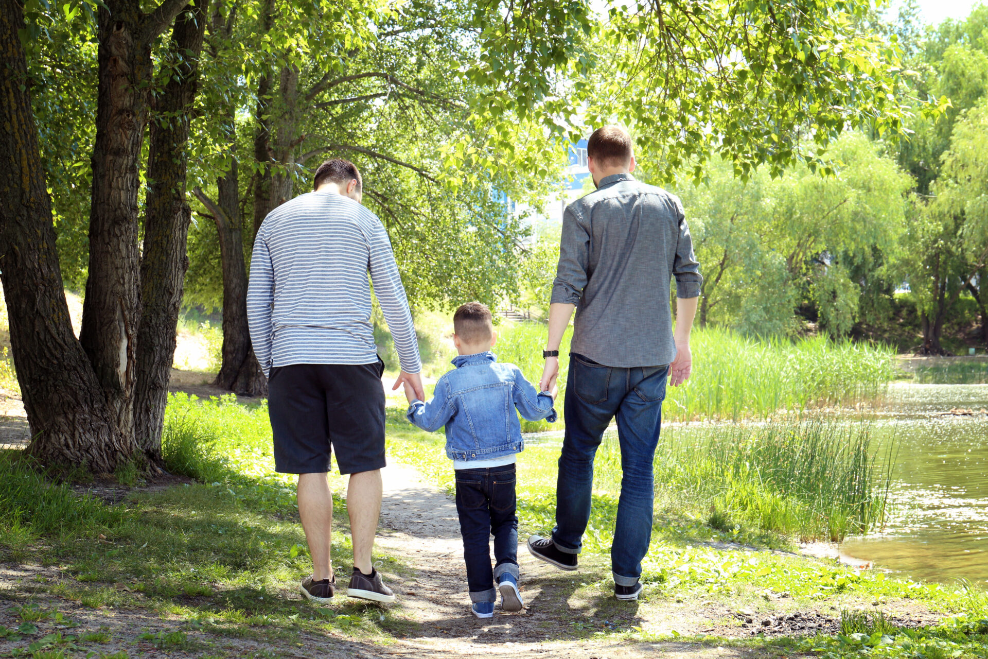 Couple coping effectively with OCD, walking outdoors with their son