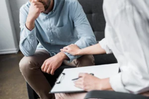 Our Therapists 2 comforting reach to a client, from caring professional Reno therapists for relationship counseling