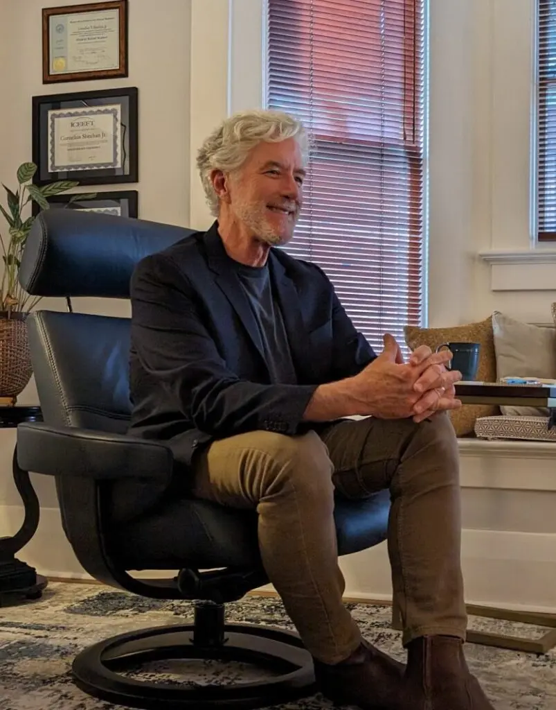 Cornelius Sheehan, LCSW, seated. Therapist in Reno. Answers to relationship counseling FAQs.