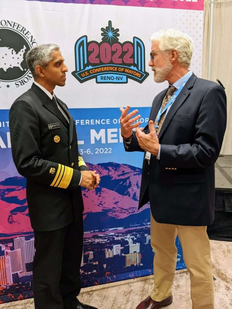 Dr. Vivek Murthy, US Surgeon General (left) in discussion with Cornelius Sheehan, LCSW about loneliness and public health
