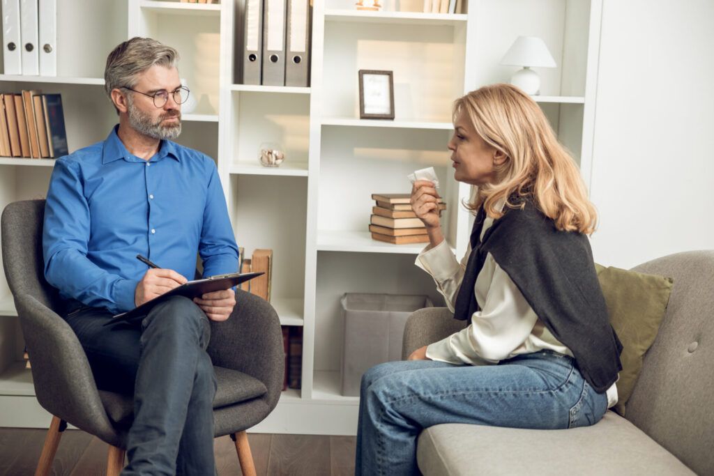 Man psychologist listening attentively to his patient's confession offering advice and counseling photo of counseling services in reno, nv with a female client, describing what we help with