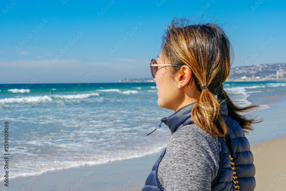 woman overlooking ocean profile view 1