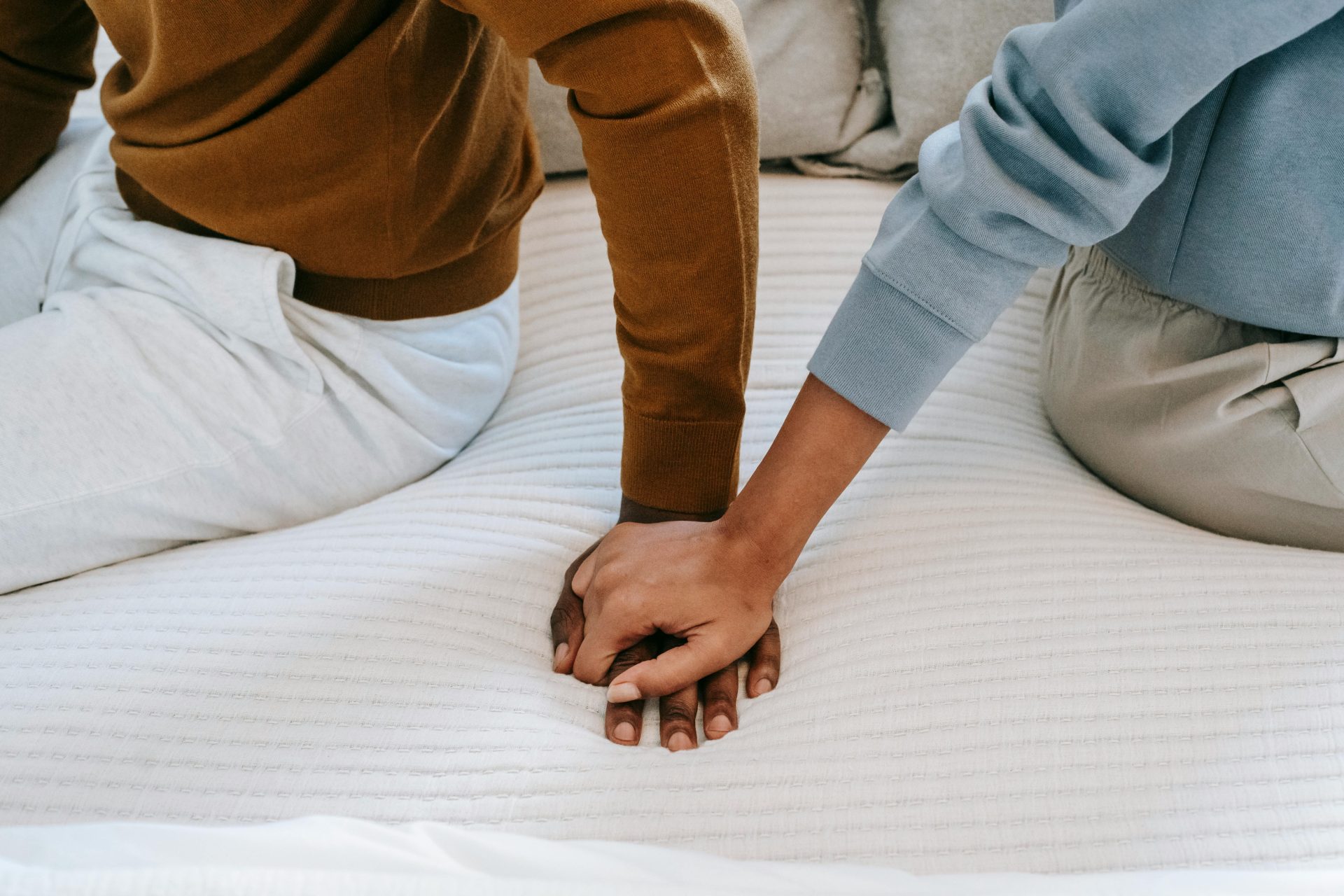 Couple Counseling & Marriage Therapy 6 Couple holding hands during marriage counseling