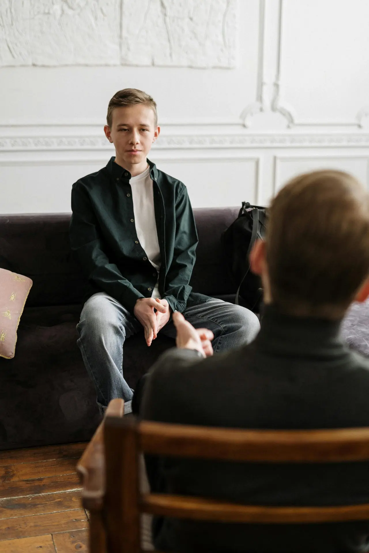 Therapist talking with a client in a counseling session
