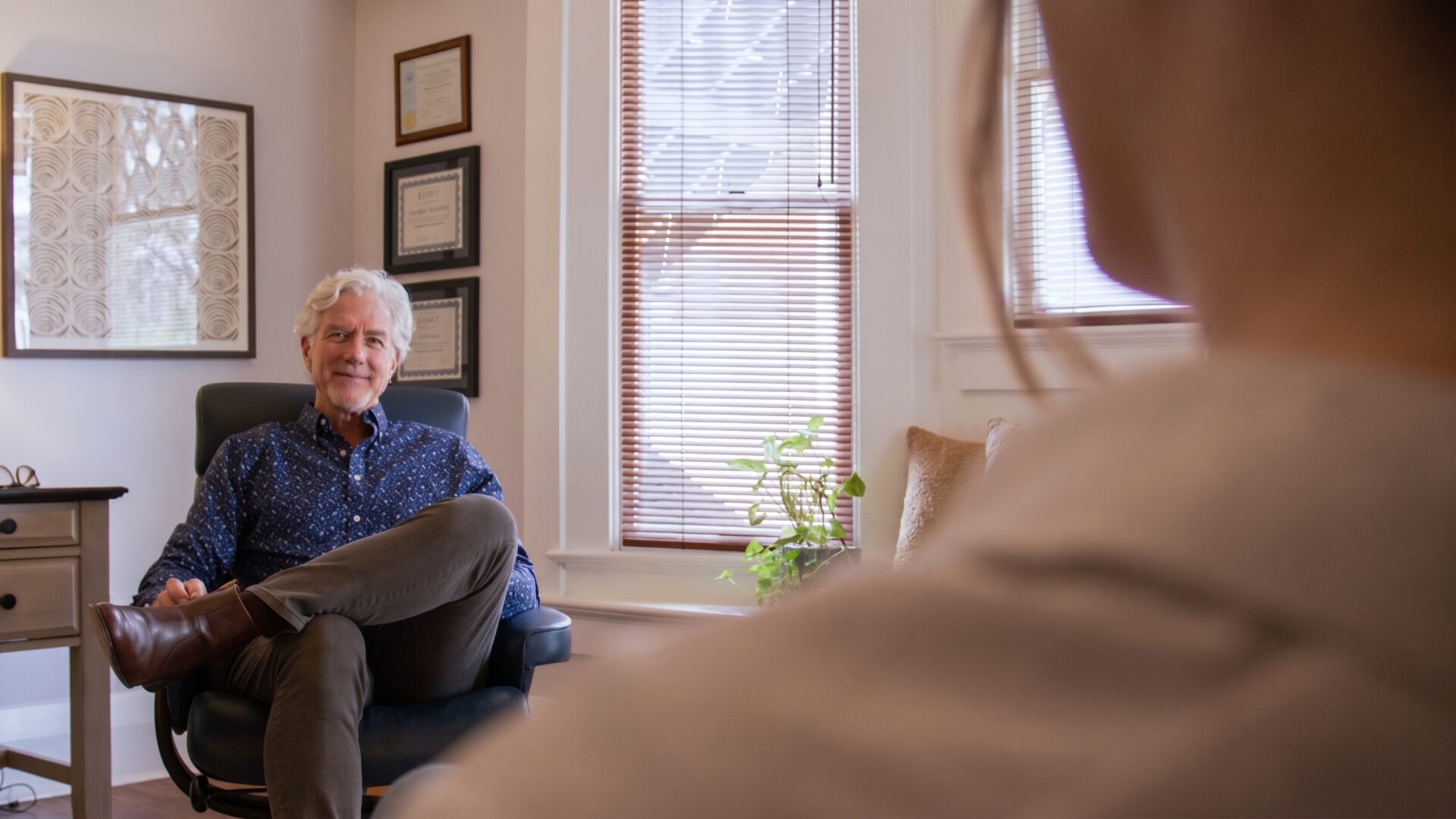 A therapist listening to a client during an individual therapy session