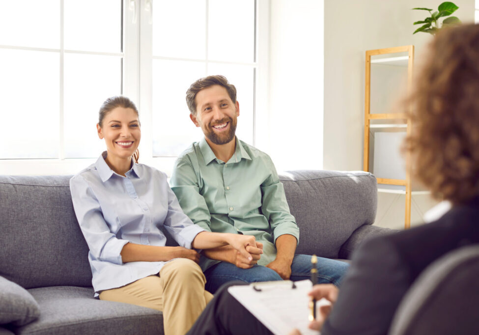 Happy married couple having therapy session with professional psychologist or psychotherapist happy couple in couples therapy in reno, nv