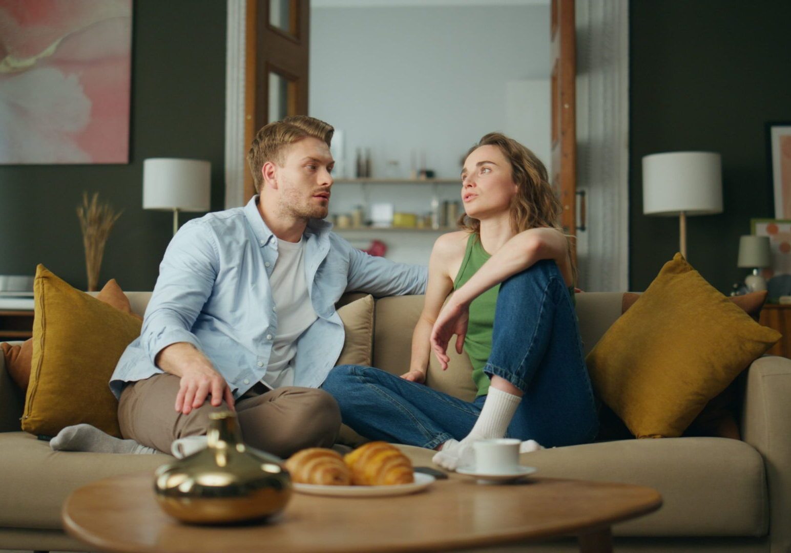 Calm family talking sofa at living room. Relaxed boyfriend girlfriend chilling young couple exploring help for relationship issues in reno, nv